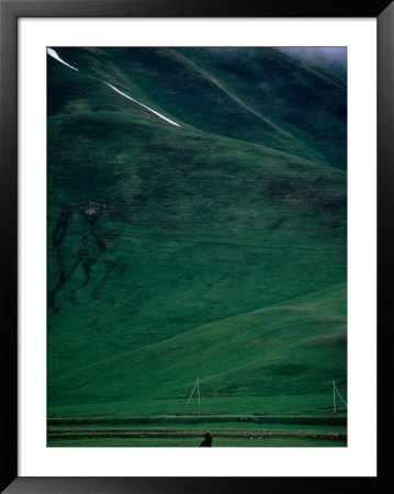 Horseman Rides Across Karaka Valley, Near Karakol, Karakol, Kyrgyzstan by Anthony Plummer Pricing Limited Edition Print image