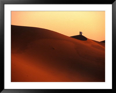 Couple On Dunes In The Erg Oriental Sand Sea, Ghadhames, Libya by Doug Mckinlay Pricing Limited Edition Print image