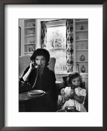Jackie Kennedy, Wife Of Senator John Kennedy, Talking On The Telephone As Her Daughter Mimics Her by Alfred Eisenstaedt Pricing Limited Edition Print image