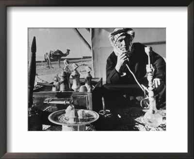 Lebanese Shepherd Smoking Water Pipe Outside His Tent by Carlo Bavagnoli Pricing Limited Edition Print image