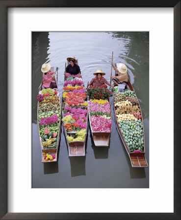 A Group Of Four Women Market Traders In Boats Laden With Fruit And Flowers, Thailand by Gavin Hellier Pricing Limited Edition Print image