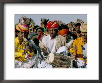 Musicians Playing The Dhol And Poongi, Bikaner Desert Festival, Rajasthan State, India by Marco Simoni Pricing Limited Edition Print image