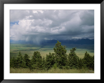 A Rainstorm Breaks Over The Flathead Valley by Annie Griffiths Belt Pricing Limited Edition Print image