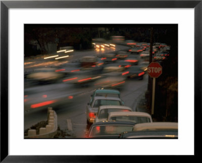 Line Of Cars At Stop Sign Waiting To Enter Solid Wall Of Racing Commuters On Pasadena Freeway by Ralph Crane Pricing Limited Edition Print image