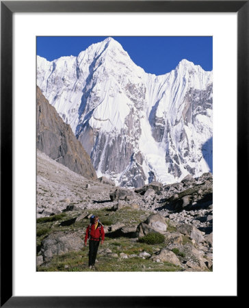 A Man Hikes Through The Karakoram Range, Pakistan by Jimmy Chin Pricing Limited Edition Print image