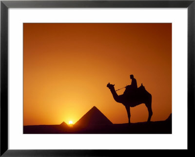 Silhouette Of Figure On Camelback At Pyramid, Giza, Cairo, Egypt by Nigel Francis Pricing Limited Edition Print image