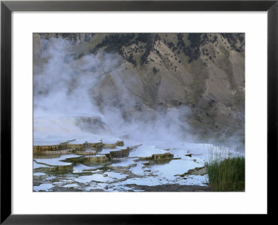 A View Of Terraced Mammoth Hot Springs With A Mountain Backdrop by Norbert Rosing Pricing Limited Edition Print image