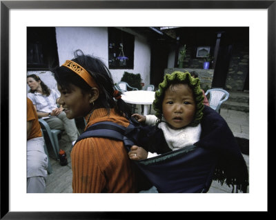 Small Baby On The Back Of Young Girl, Nepal by David D'angelo Pricing Limited Edition Print image