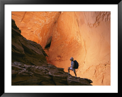 A Hiker Walks Through A Canyon At Grandstaircase Escalante National Monument by Kate Thompson Pricing Limited Edition Print image