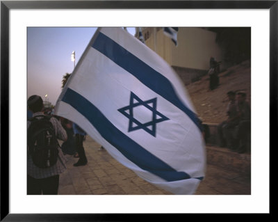 Israel, Jerusalem: Israeli Flag Being Waved At The Wailing Wall by Brimberg & Coulson Pricing Limited Edition Print image