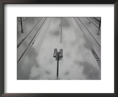 Security Cameras Overlook The Platform At The Osterport Rail Station by Cotton Coulson Pricing Limited Edition Print image