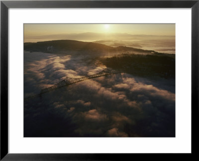 Aerial View Of A Bridge Over The Foggy Columbia River by Cotton Coulson Pricing Limited Edition Print image