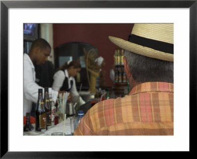 Back View Of A Man In A Straw Hat Sitting At A Bar, Cafe Taberna, Havana by Eitan Simanor Pricing Limited Edition Print image