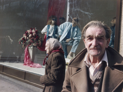 Elderly Couple On Oxford Street, London by Shirley Baker Pricing Limited Edition Print image