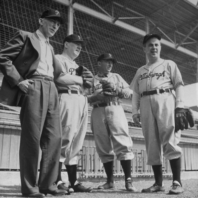 President Frank E. Mckinney And Bing Crosby Standing Around The Dug Out by Loomis Dean Pricing Limited Edition Print image