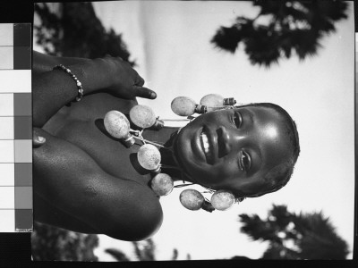 Congolese Native Girl Wearing Necklace Of Phtographers' Flashbulbs Strung Together, Belgian Congo by Nat Farbman Pricing Limited Edition Print image