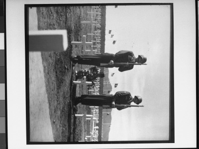 Little Korean Girl Places Wreath Of Flowers On Grave Of American Soldier, During The Korean War by Alex Klein Pricing Limited Edition Print image