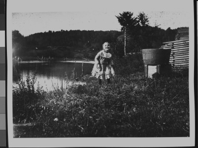 Sweet Little Girl Playing By A Pond In The Backyard Of Lance's House; She Is His Niece by George B. Brainerd Pricing Limited Edition Print image