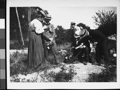 Chipping Away And Examining Rocks And Minerals In The Hopes Of Identifying Them by Wallace G. Levison Pricing Limited Edition Print image