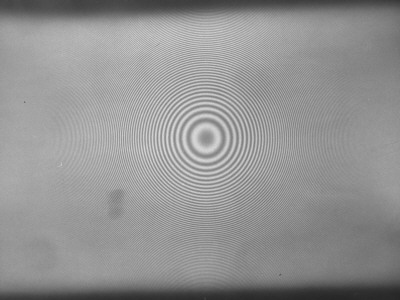 A Lamp Thowing Light Patterns Of Rings Onto A Blank Surface by Andreas Feininger Pricing Limited Edition Print image