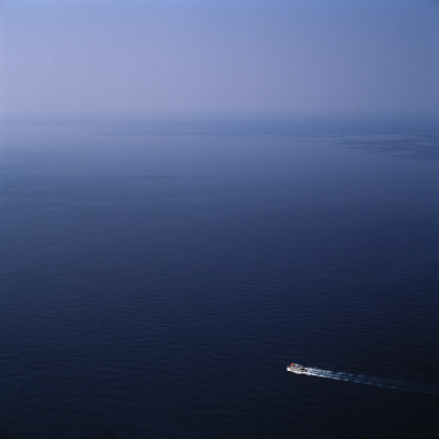Small Boat On Big Blue Sea by Bjorn Wiklander Pricing Limited Edition Print image