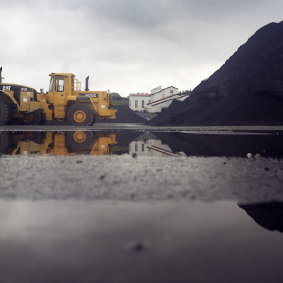 A Bulldozer And A Heap Of Gravel by Atli Mar Pricing Limited Edition Print image