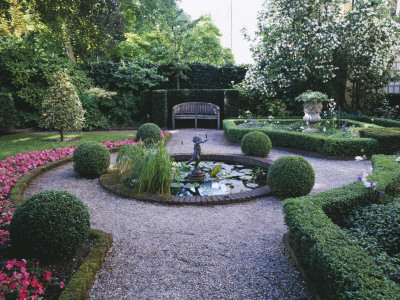 Amsterdam: Private Garden- Box Hedging, Clipped Hollies, Bedding Begonias, And Cupid Water Fountain by Clive Nichols Pricing Limited Edition Print image