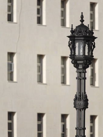 Ornate Streetlamp And Vertical Windows In Entrance Courtyard Of Escuela De Nautica, Cadiz Spain by David Borland Pricing Limited Edition Print image