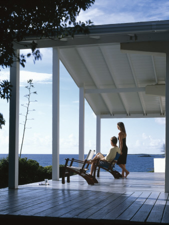 House On Channel Cay, Abacos Island, Bahamas, Verandah With Couple by Nicholas Kane Pricing Limited Edition Print image