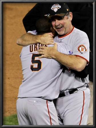Texas Rangers V. San Francisco Giants, Game 5:  Manager Bruce Bochy Celebrates With Juan Uribe by Stephen Dunn Pricing Limited Edition Print image