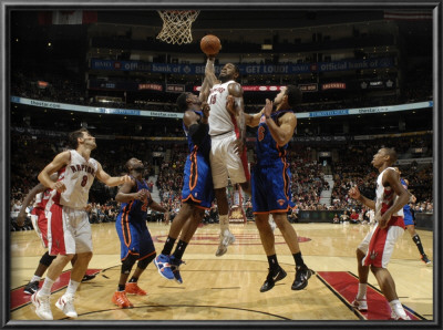 New York Knicks V Toronto Raptors: Amir Johnson, Amar'e Stoudemire And Landry Fields by Ron Turenne Pricing Limited Edition Print image
