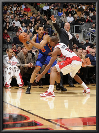 New York Knicks V Toronto Raptors: Landry Fields And Demar Derozan by Ron Turenne Pricing Limited Edition Print image