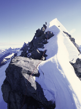 Climbing Up A Snowy Ridge On Mt. Aspiring, New Zealand by Michael Brown Pricing Limited Edition Print image