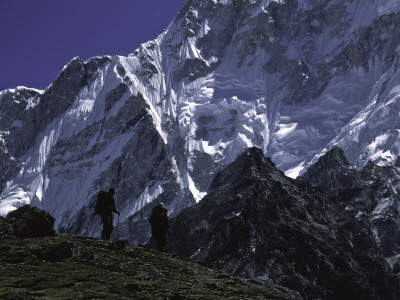 Climbers Passing By Mount Nuptse, Nepal by Michael Brown Pricing Limited Edition Print image