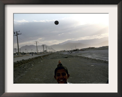 Afghan Boys Play With A Ball In Kabul, Afghanistan, Friday, July 7, 2006 by Rodrigo Abd Pricing Limited Edition Print image