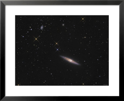 A Close Up Of Ngc 4013, An Edge-On Unbarred Spiral Galaxy In The Constellation Ursa Major by Stocktrek Images Pricing Limited Edition Print image