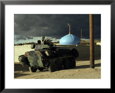 Vehicle Commander Glares Into The Military Operations On Urban Terrain Town by Stocktrek Images Pricing Limited Edition Print image