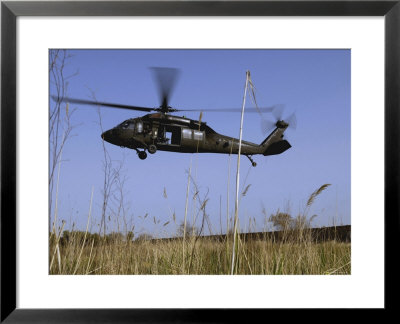 March 31, 2007, A Us Army Uh-60 Black Hawk Helicopter Prepares To Pick Up Soldiers by Stocktrek Images Pricing Limited Edition Print image