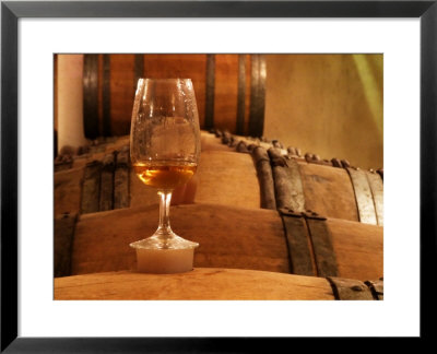 Glass Of White Wine On Bung Hole Stopper, Wine Cellar Of Jo Pithon, Loire Valley, France by Per Karlsson Pricing Limited Edition Print image