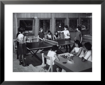 Two Girls Sitting At A Table Are Playing Draughts, Four Young Woman Are Playing Ping-Pong by A. Villani Pricing Limited Edition Print image