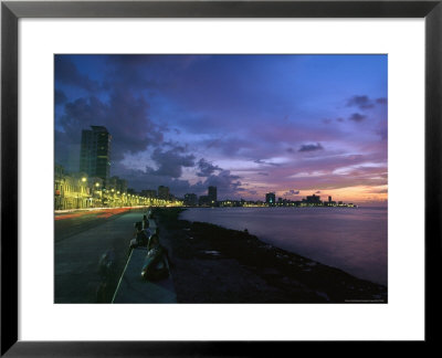 Twilight View Of Young Cubans Sitting On City's Seawall by Steve Winter Pricing Limited Edition Print image