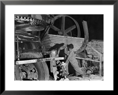 African American Worker Mrs. Rosalie Ivy Using Shovel To Mix A Special Mud Used To Seal The Hole by Margaret Bourke-White Pricing Limited Edition Print image