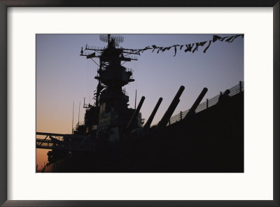 Silhouette Of The Battleship U.S.S. Wisconsin At Port In Norfolk. by O. Louis Mazzatenta Pricing Limited Edition Print image