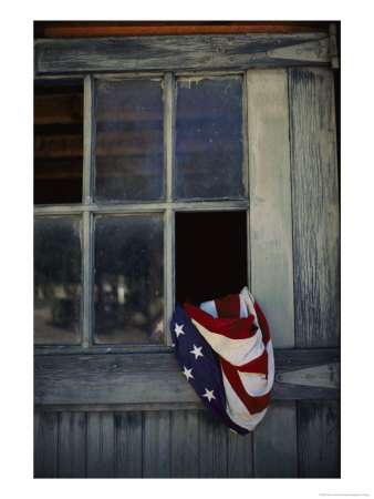 An American Flag Lies Loosely Bunched In An Open Window by Raul Touzon Pricing Limited Edition Print image