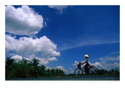 Women In Ao Dais On Bicycles, Vietnam by John Banagan Pricing Limited Edition Print image