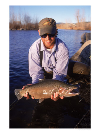 Portrait Of A Flyfisherman Holding His Catch by Larry Stanley Pricing Limited Edition Print image