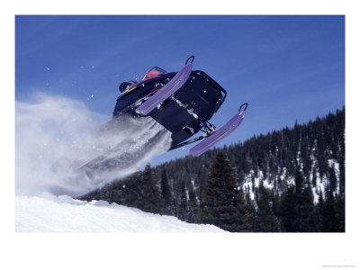 Man Riding Snowmobile Through Big Horn Mts, Wy by Mike Mcclure Pricing Limited Edition Print image