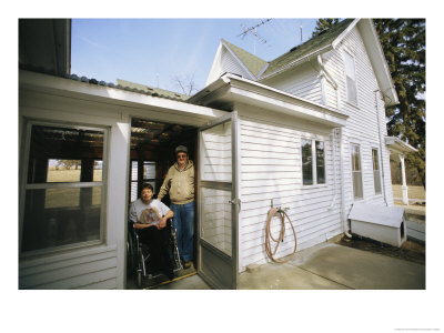 A Man And A Woman In A Wheelchair At A Screen Door by Joel Sartore Pricing Limited Edition Print image