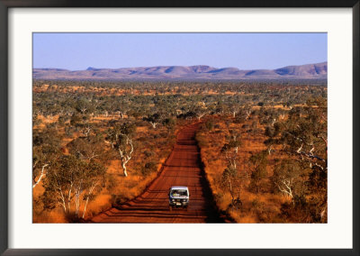 Car On Outback Road, Karijini National Park, Australia by Oliver Strewe Pricing Limited Edition Print image