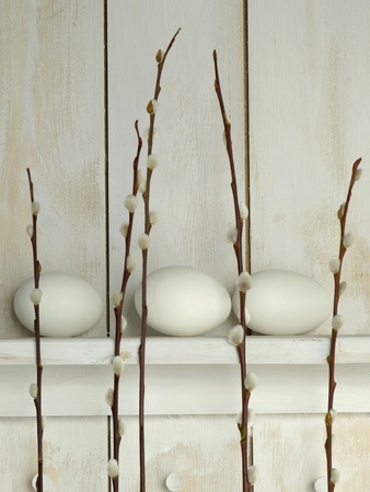 Easter Eggs Lying On Shelf With Pussy Willow Twigs by Achim Sass Pricing Limited Edition Print image